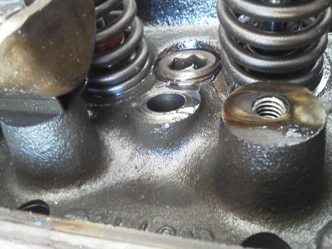 1988 Ford Bronco - Engine cylinder head detail with valve springs and mounting points visible.
