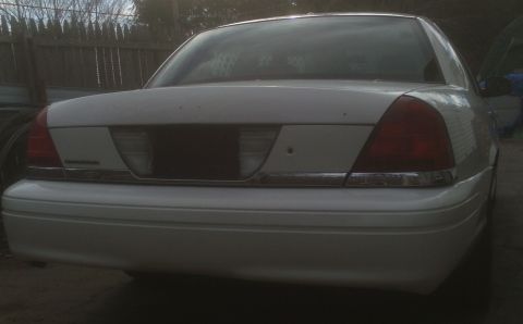 2006 Ford Crown Victoria - Rear view of a white 2006 Ford Crown Victoria sedan.