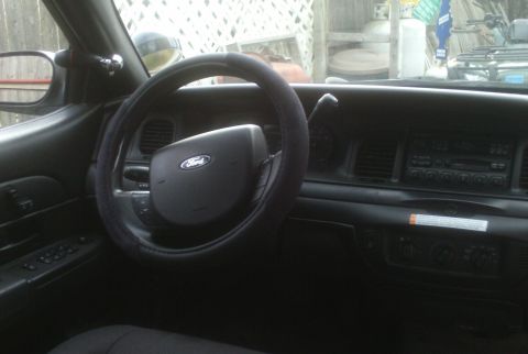 2006 Ford Crown Victoria - Interior of a 2006 Ford Crown Victoria, the dashboard and steering wheel.