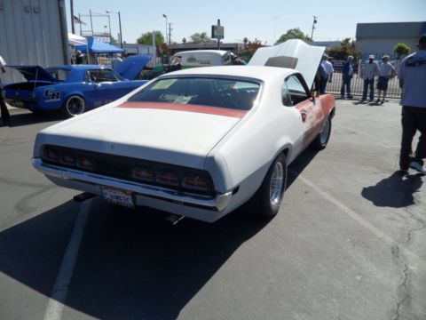 1973 Ford Ranchero - Rear view of a 1970 Ford Ranchero at a car show, with another blue car in the background.