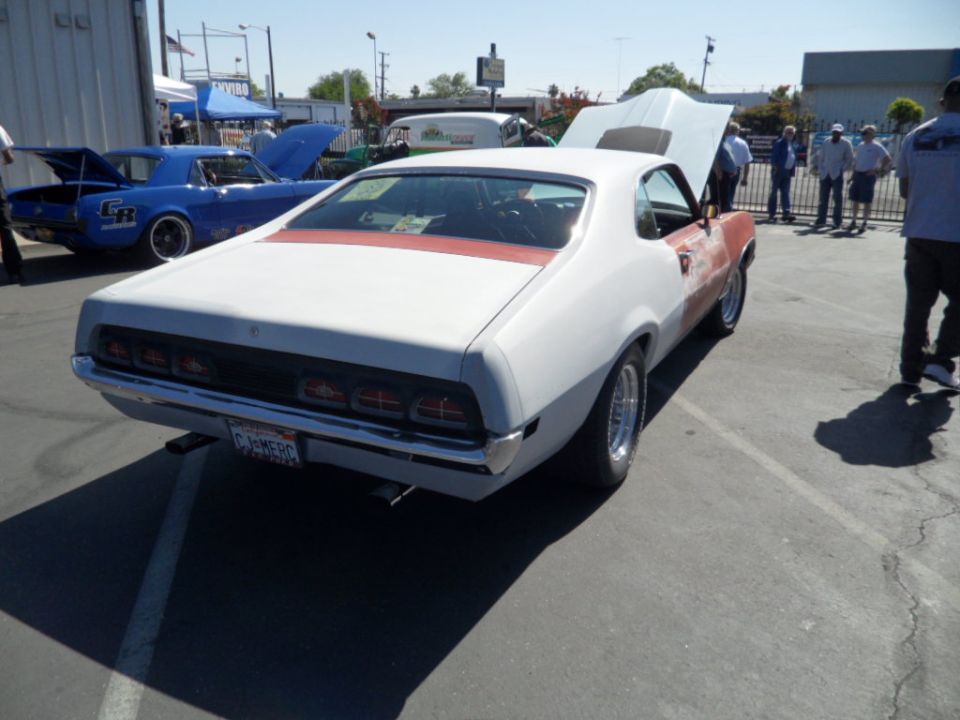 1970 Ford Ranchero with primer on front fender, red stripe on roof