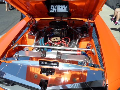1973 Ford Ranchero - Custom engine bay with "514 mach1" text. The vehicle is orange and features chrome detailing.