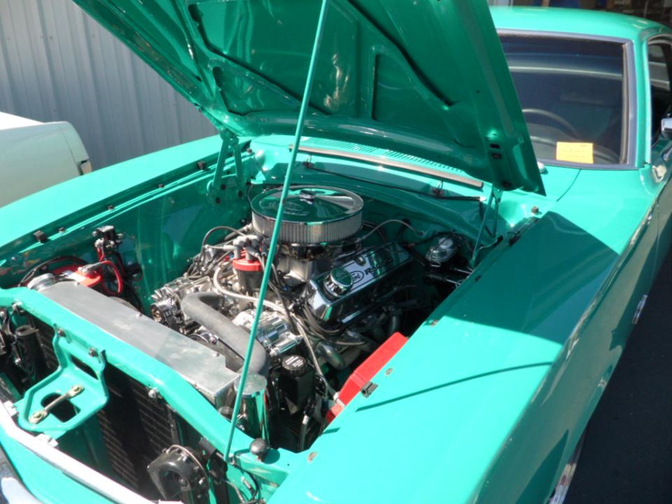 Teal 1973 Ford Ranchero engine bay with chrome air cleaner and V8 engine