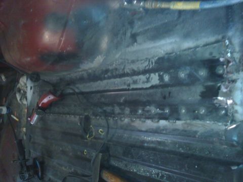 1978 Ford Bronco - The interior of a vehicle shows exposed metal and tools, indicating ongoing repair work.