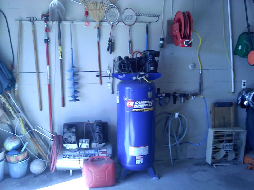 Garage scene with tools and air compressors
