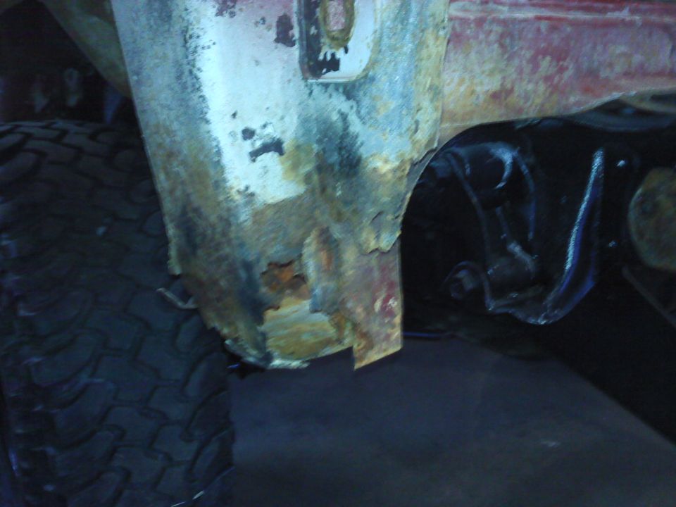 Rusted wheel well and suspension of a vehicle