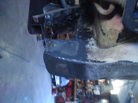 1978 Ford Bronco - The underside of a vehicle is shown, with focus on a specific component.