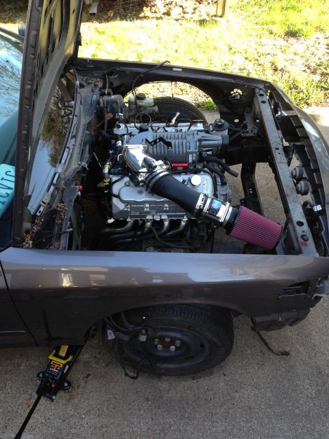 2004 Ford Crown Victoria - Custom engine installation with a prominent supercharger and exposed engine bay, likely a modification project.