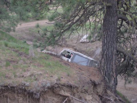 2005 Jeep Wrangler - An off-road vehicle has gone off the road and is stuck in a ditch.