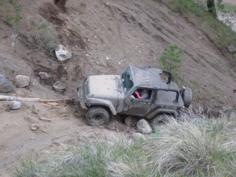 2005 Jeep Wrangler - A 2005 Jeep Wrangler tackles a challenging off-road course with steep inclines and large rocks.