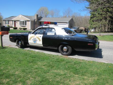 1991 Ford LTD Crown Victoria - This police car is marked "HIGHWAY PATROL" and has an "OUT OF SERVICE" sign on the door.
