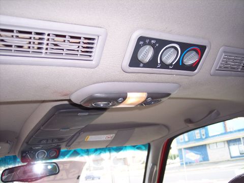 1999 Chevrolet Suburban - Overhead console view of the climate controls and air vents in a 1999 Chevrolet Suburban.