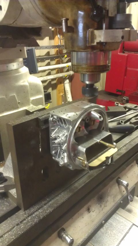 1980 Pontiac Trans Am - Metal part being machined on a milling machine in a workshop.