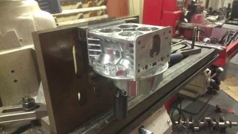 1980 Pontiac Trans Am - A close-up of an engine block being worked on in a machine shop.
