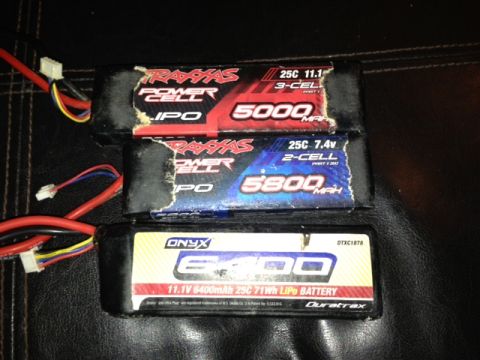 1986 Ford Bronco - A collection of three rechargeable lithium polymer batteries for remote-controlled vehicles, displaying various capacities and voltage rati…