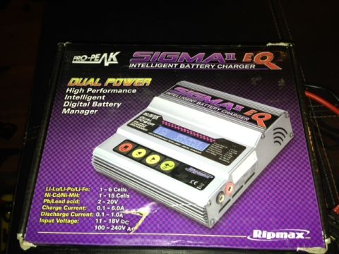 1986 Ford Bronco - Box for a Pro-Peak Sigma II EQ Dual Power Intelligent Battery Charger, detailing its features and specifications.
