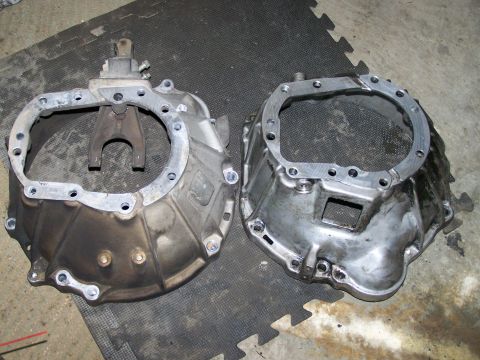 1988 Suzuki Samurai - Comparison of two transmission bell housings, one appearing dirtier than the other.