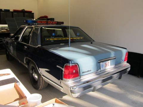1991 Ford LTD Crown Victoria - This 1991 Ford Crown Victoria LTD police car features a light bar and a two-tone paint scheme.
