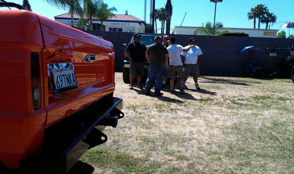 Orange SUV rear bumper and California license plate 69TNK A