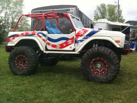1992 Ford Bronco - This heavily modified SUV features a custom roll cage and striking skull and crossbones graphics.