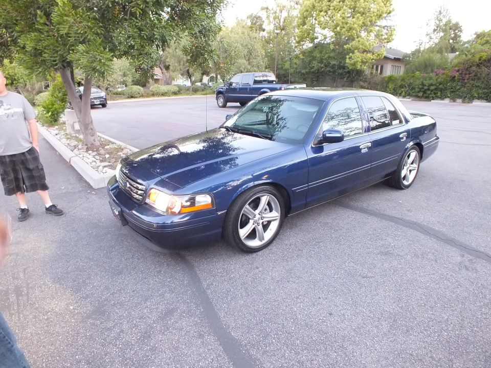 Dark blue Ford Crown Victoria front three-quarter parked on residential street