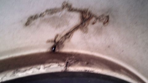 1979 Ford Bronco - This image shows significant rust and damage to an interior panel, not a 1979 Ford Bronco.