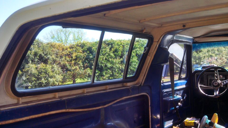 Interior view of 1979 Ford Bronco with sliding rear windows and dashboard