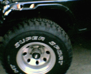 1995 Mitsubishi Eclipse - The Micky Thompson Classic rims and 33x12.50 All sport Mudd terrain tires