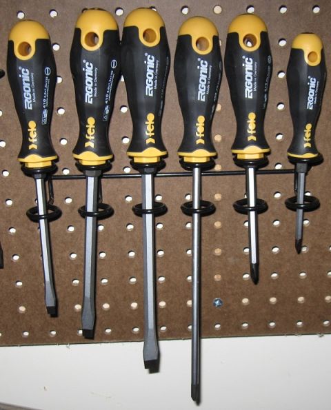 2000 Ford Crown Victoria - A collection of Felo Ergo-Nomic screwdrivers made in Germany are neatly organized on a pegboard.