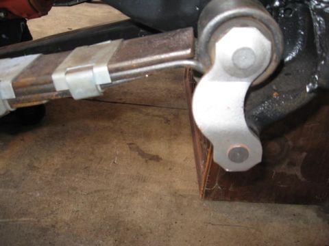 1963 Ford Galaxie - Close-up view of a vehicle's leaf spring and suspension components, showing metal clamps and a bracket.