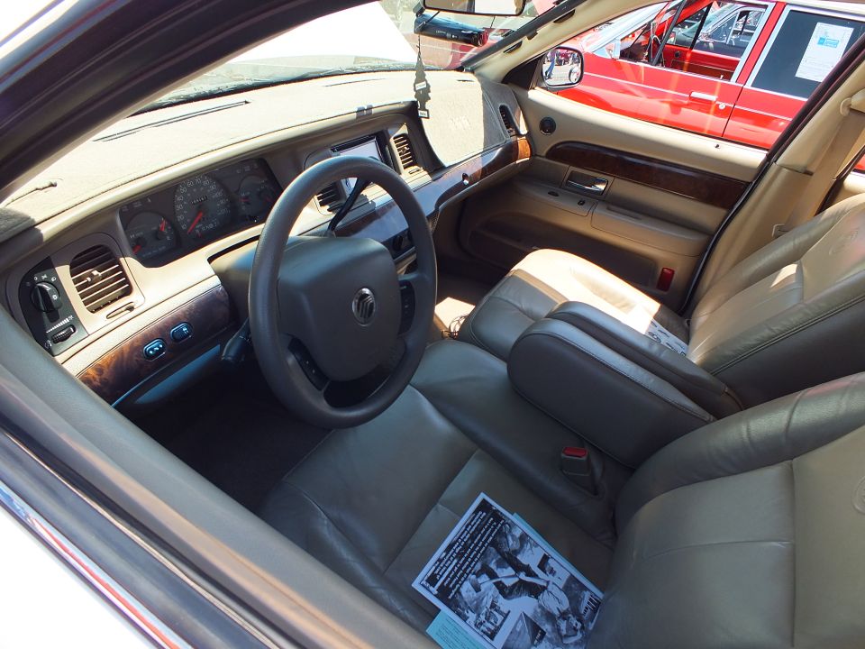 Mercury sedan interior with woodgrain dash, tan leather and a flyer
