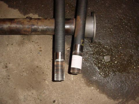 1992 Ford Bronco - Close-up of axle shafts and a differential housing, suggesting automotive repair or parts.