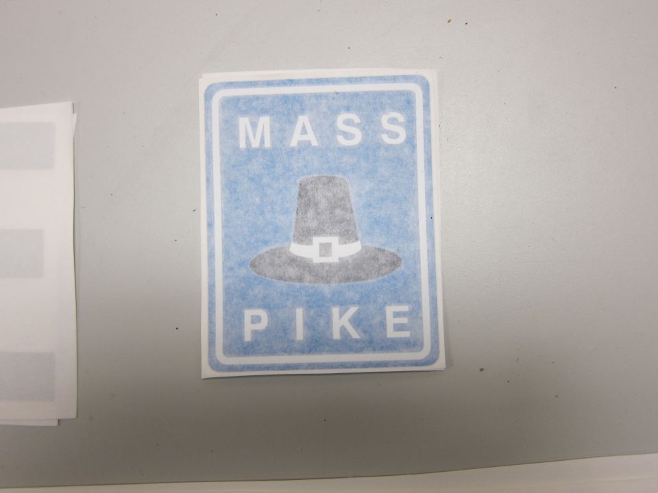 Mass Pike sign with pilgrim hat graphic