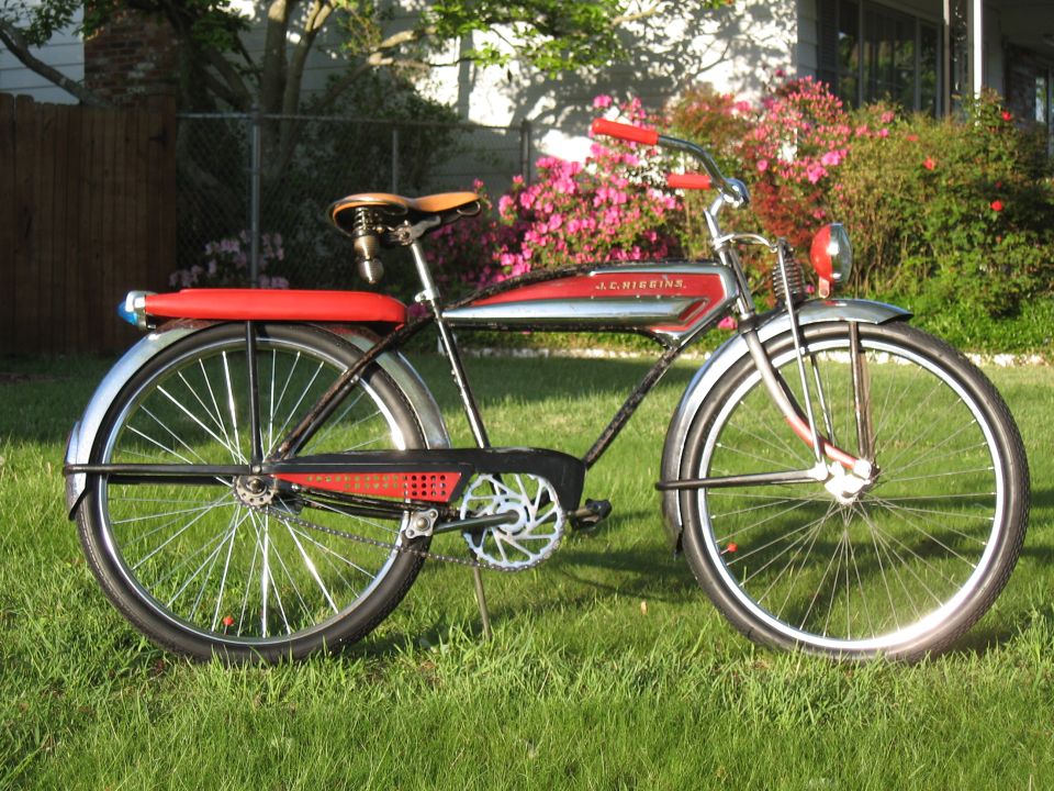 J.C. Higgins bicycle with red handlebars and seat, chrome tank, and red rear fender