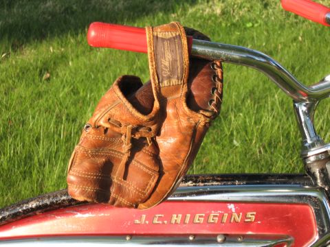 1994 Ford Bronco - Vintage J.C. Higgins bicycle with a baseball glove attached to the handlebars.