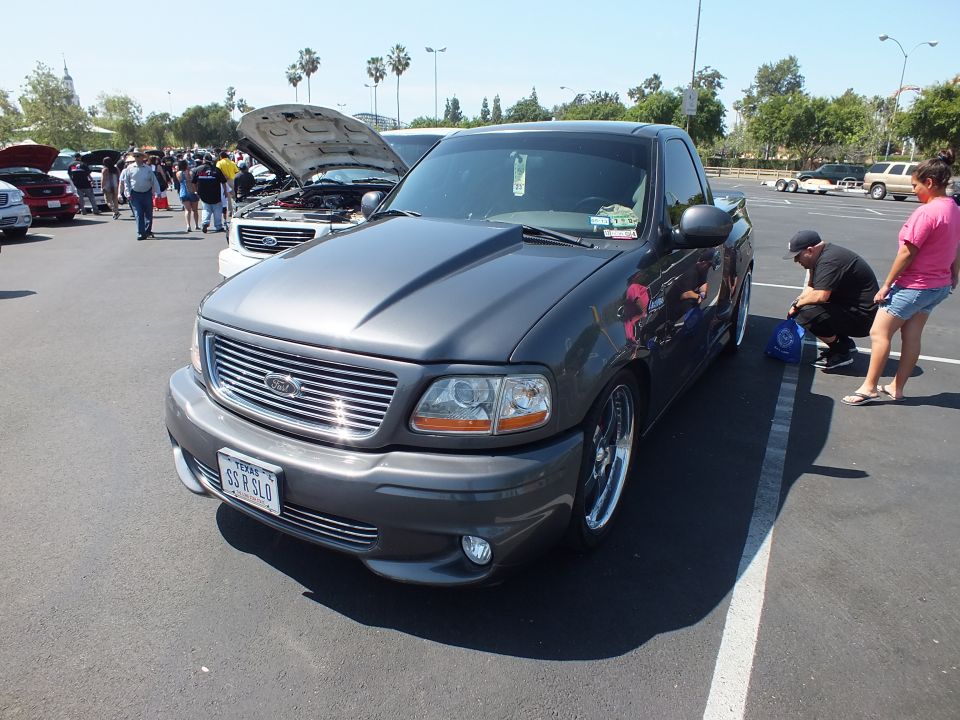 Front three-quarter of a gray Ford F-150 Lightning pickup with billet grille