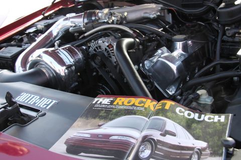 1992 Ford Crown Victoria - Magazine open in engine bay, showing article about a Ford Crown Victoria.