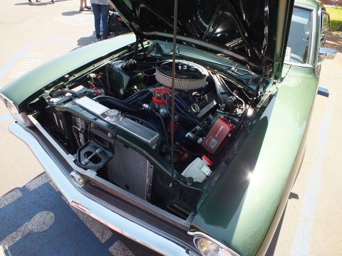 2003 Ford Crown Victoria - engine bay of a green car under a raised hood, featuring a chrome round air cleaner, valve covers, and aftermarket ignition box.