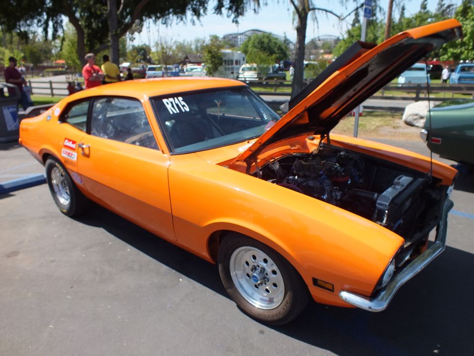 Orange Ford Maverick coupe on slot mag wheels with hood and trunk open