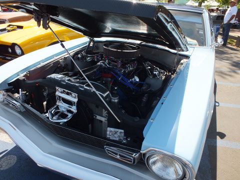 2003 Ford Crown Victoria - light-blue car shows its raised hood revealing a chrome-dressed V8 with a round air cleaner and blue accents.