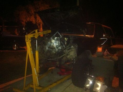 1989 Ford Bronco - Engine removal in progress for a 1989 Ford Bronco, utilizing an engine hoist and cross member.