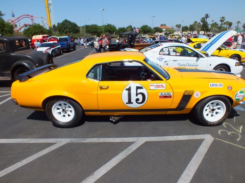 Yellow Mustang race car #15 Boss 302 with Union sticker, side profile view