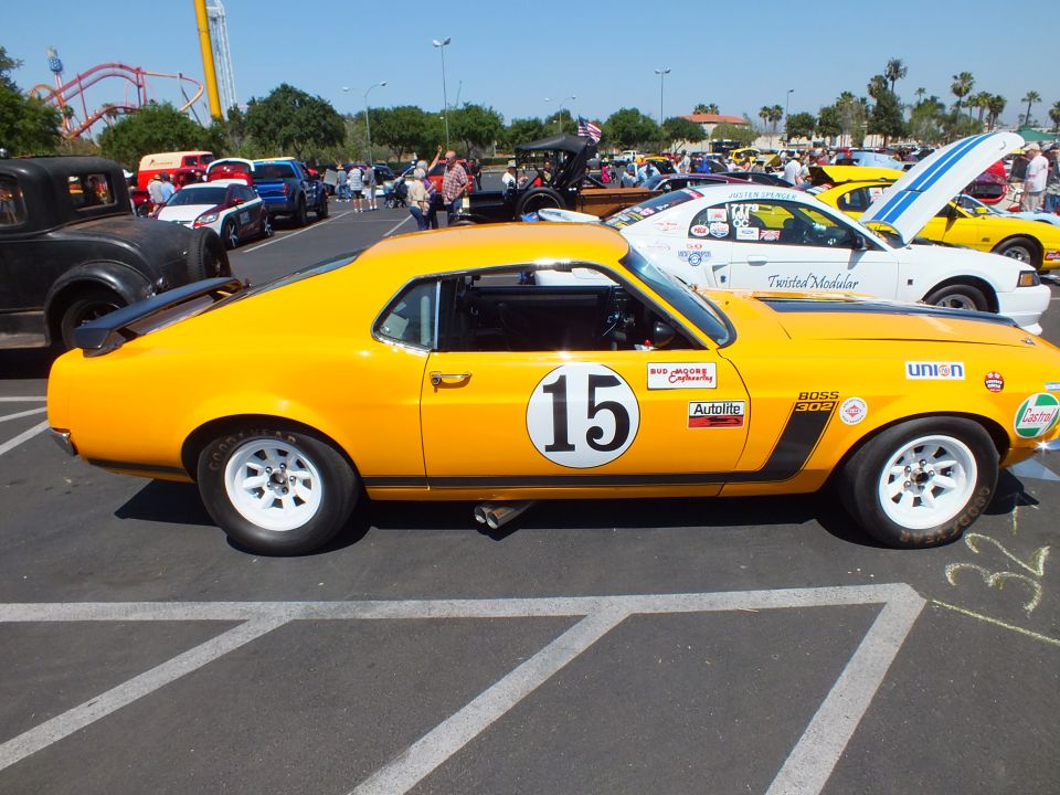 Yellow Mustang race car #15 Boss 302 with Union sticker, side profile view