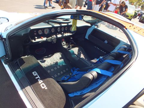 Interior of light blue GT40 with GT40 floor mats and blue harness