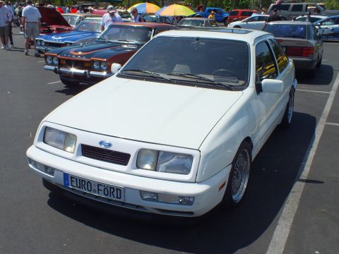 White Ford hatchback sedan with EURO FORD plate at outdoor car show