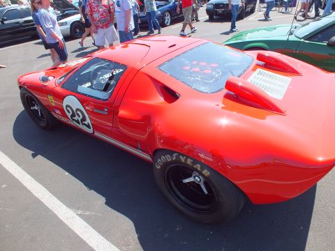 Red number 22 race coupe rear three-quarter on Goodyear tires at show