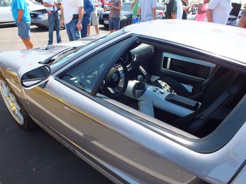 Silver Ford GT gray interior through side window with center console
