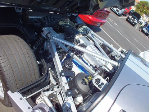 Mid-mounted supercharged V8 engine bay of a silver Ford GT