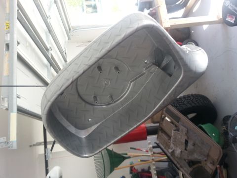 1994 Ford Bronco - Plastic tub with diamond plate pattern, possibly for storage or utility use.