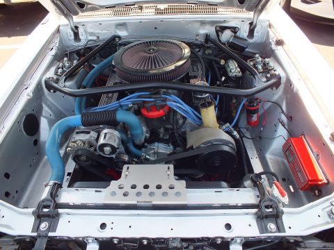 Detailed engine bay with chrome air cleaner and blue ignition wires